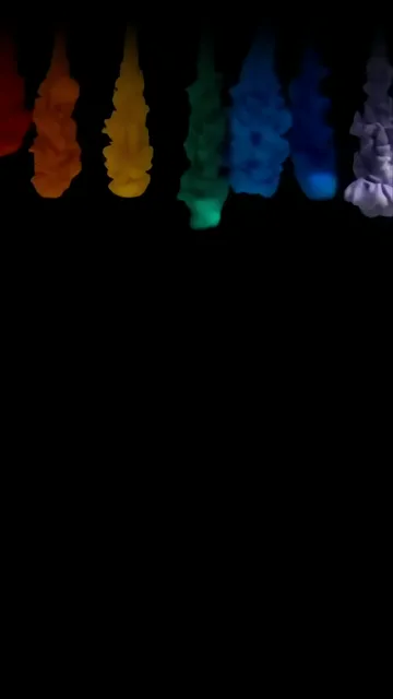 Rainbow Smoke Drops Falling In Dark Background