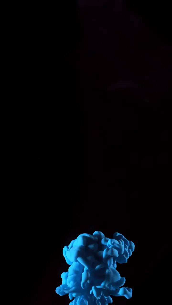 Blue Ink Drop Explosion In Dark Background