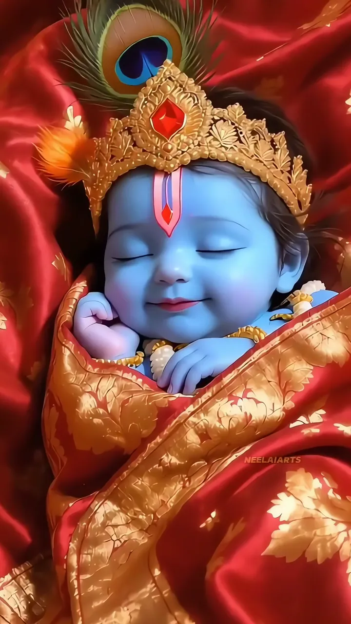 Baby Krishna Sleeping With Peacock Feather Crown And Red Silk