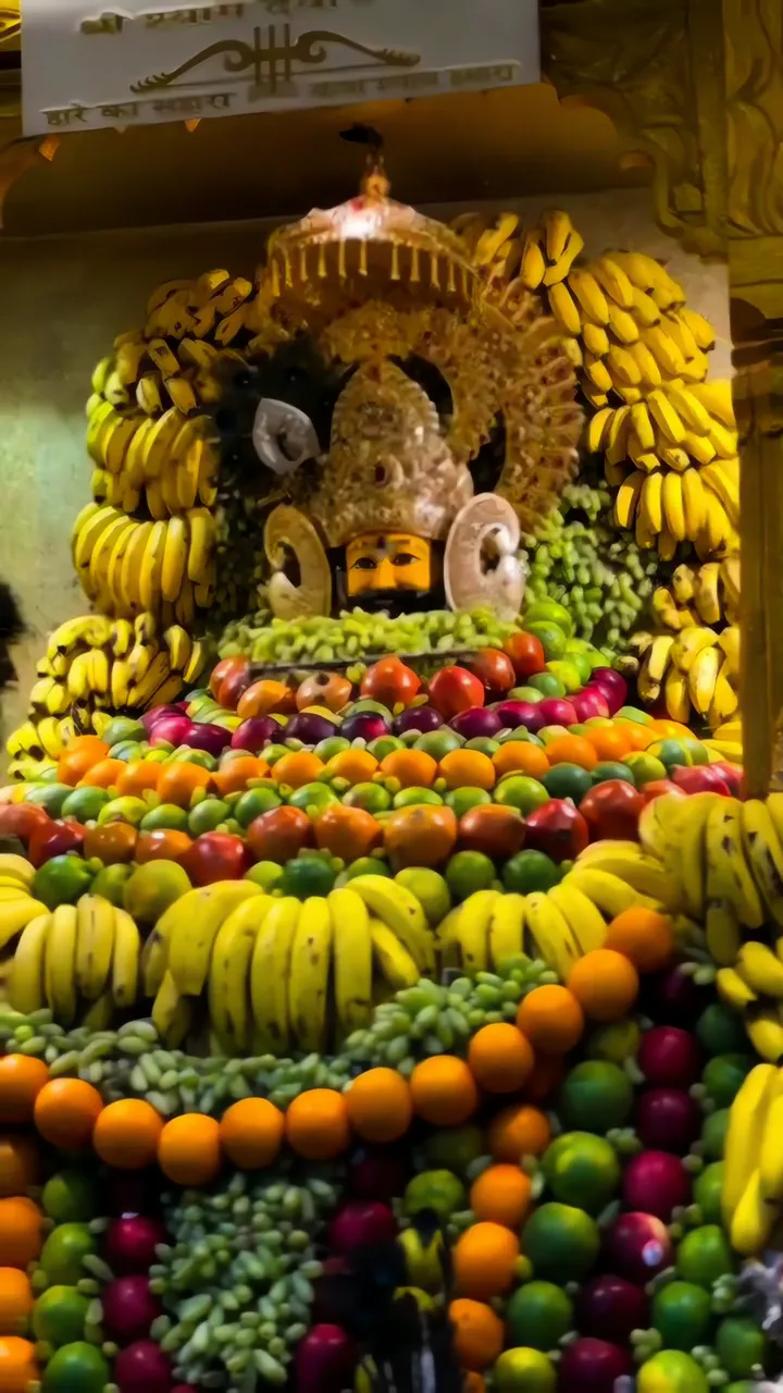 Krishna Idol Surrounded By Fruit Offering At Khatushyam Temple