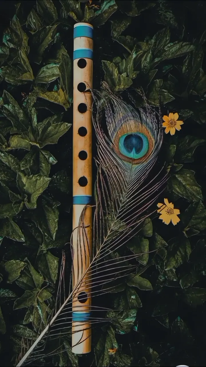 Bamboo Flute With Peacock Feather And Yellow Flowers