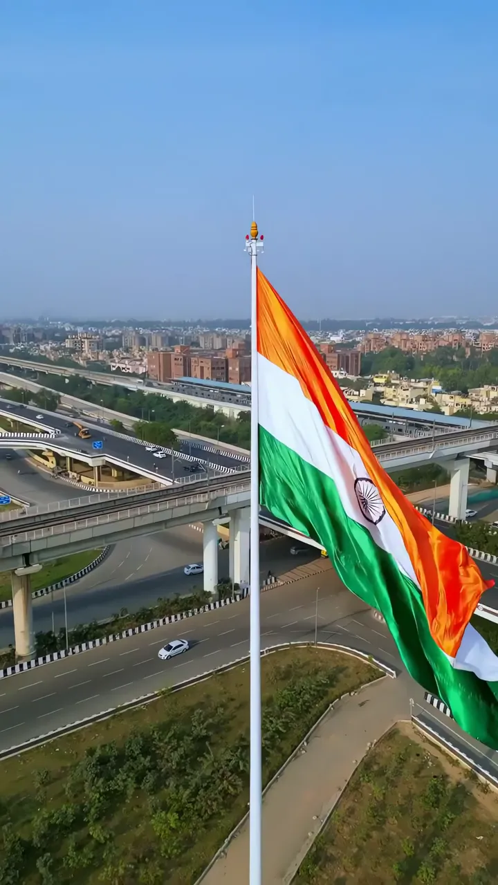 India Flag Flying High Over Urban Highway On Independence Day
