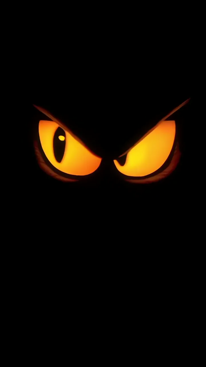 Frightening Orange Glowing Eyes In Dark Horror Scene