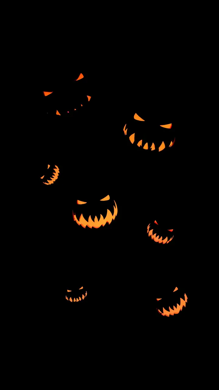 Scary Halloween Pumpkins With Glowing Orange Eyes